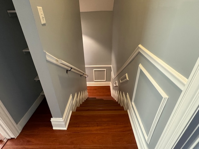 stairway featuring wood-type flooring