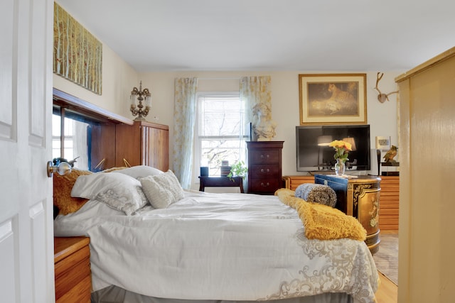 bedroom with hardwood / wood-style flooring