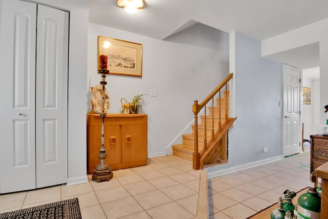 stairs featuring tile patterned flooring