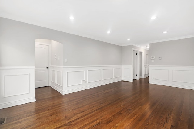 unfurnished room with dark hardwood / wood-style floors and crown molding