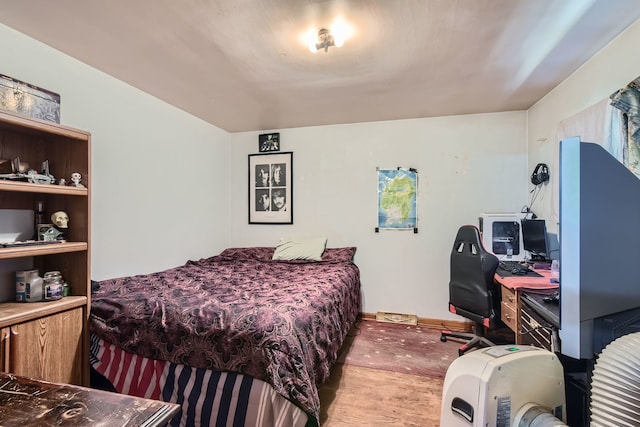 bedroom featuring light carpet