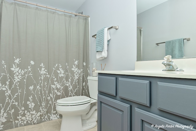 bathroom with tile patterned floors, vanity, and toilet