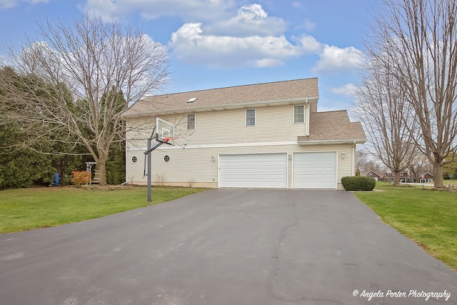 view of front property with a front yard and a garage