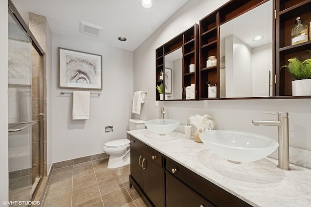 full bathroom with a sink, visible vents, toilet, and a shower stall