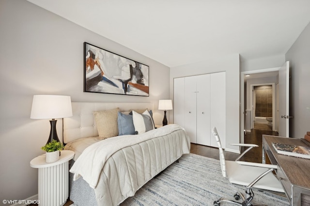 bedroom with a closet and wood finished floors