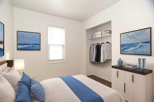 bedroom featuring a closet and dark hardwood / wood-style floors