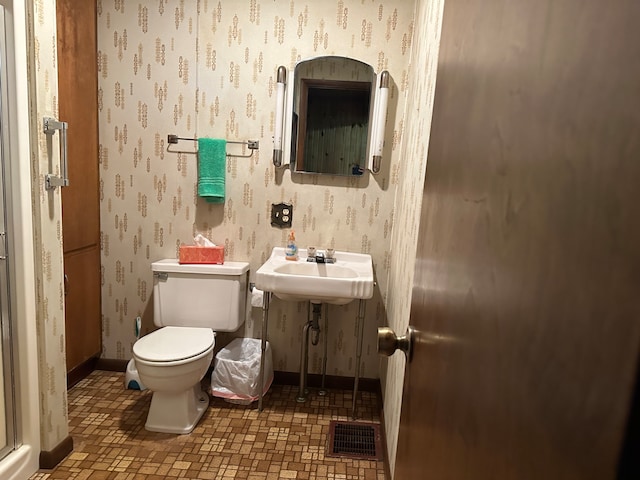 bathroom with toilet and sink