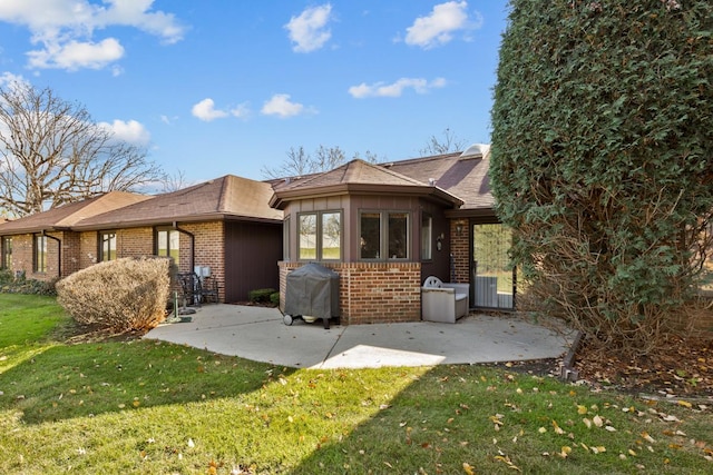 exterior space featuring a patio area and a front yard