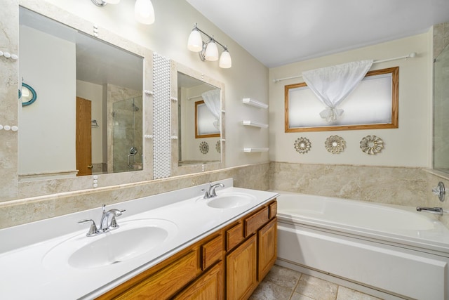 bathroom featuring tile patterned flooring, vanity, and independent shower and bath