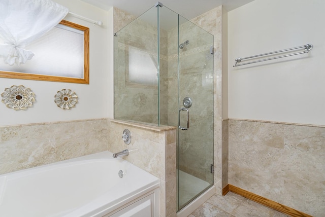 bathroom featuring plus walk in shower and tile patterned flooring