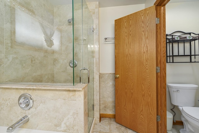 bathroom with sink, an enclosed shower, and toilet