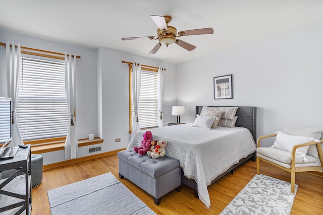 bedroom with ceiling fan and light wood-type flooring