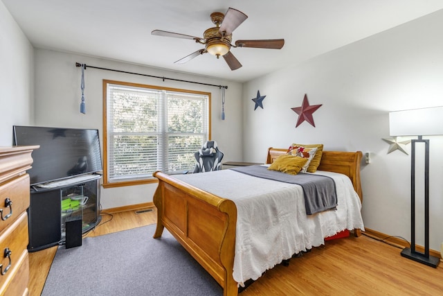 bedroom featuring ceiling fan and light hardwood / wood-style flooring