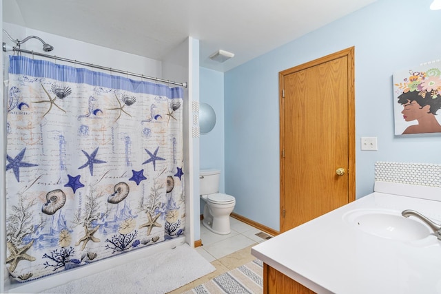 bathroom with vanity, tile patterned flooring, toilet, and a shower with shower curtain