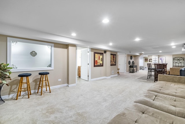 living room featuring light colored carpet and bar area