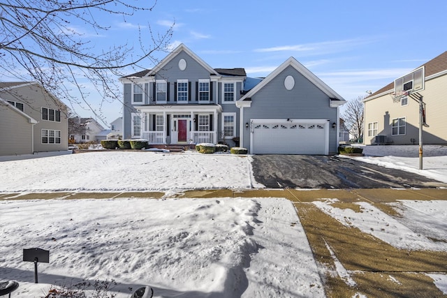 view of front of property with a porch and a garage