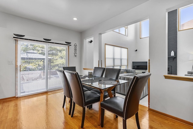 dining space with light hardwood / wood-style flooring