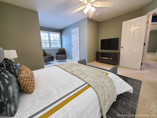 bedroom with ceiling fan, baseboards, and light colored carpet