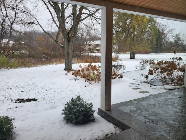 view of yard layered in snow