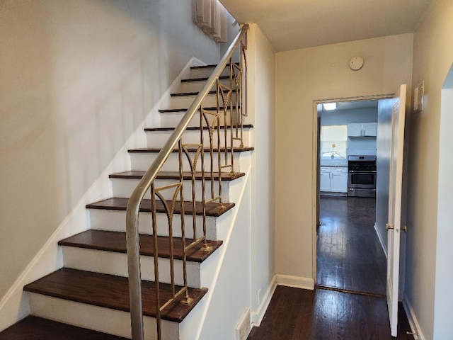 7715 S Paxton Ave, Chicago, IL 60649 - stairs featuring wood finished floors and baseboards