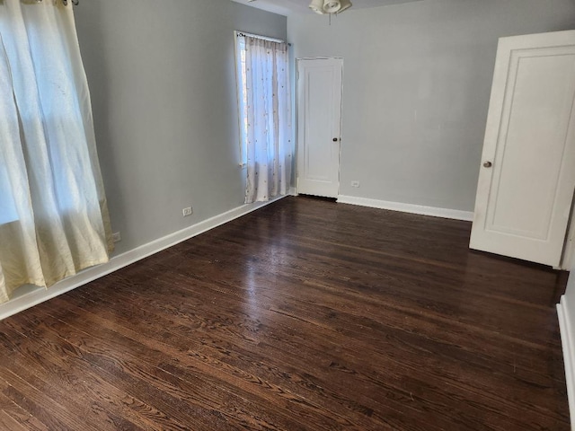 7715 S Paxton Ave, Chicago, IL 60649 - empty room with dark wood-type flooring and baseboards