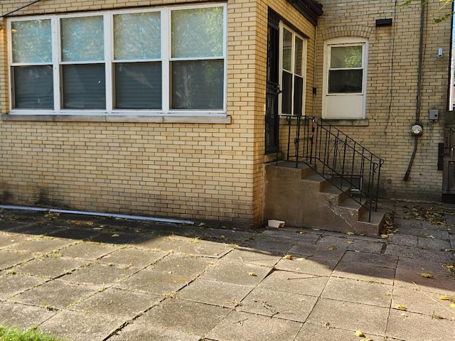 7715 S Paxton Ave, Chicago, IL 60649 - doorway to property featuring brick siding