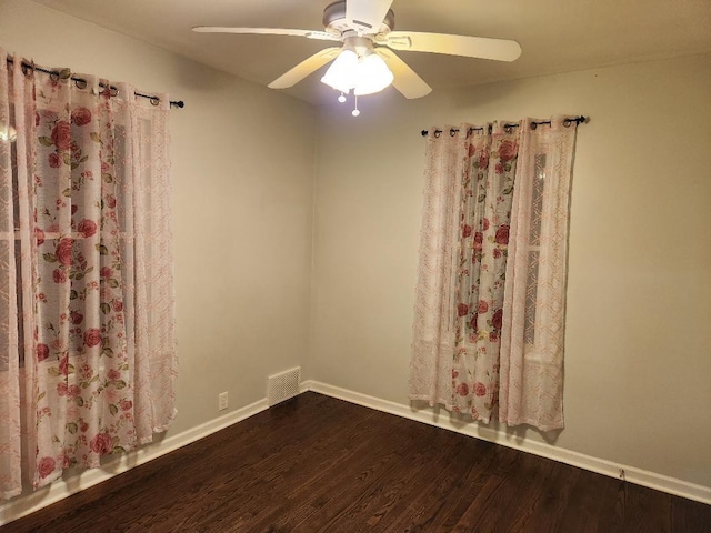 7715 S Paxton Ave, Chicago, IL 60649 - spare room featuring wood finished floors, ceiling fan, and baseboards