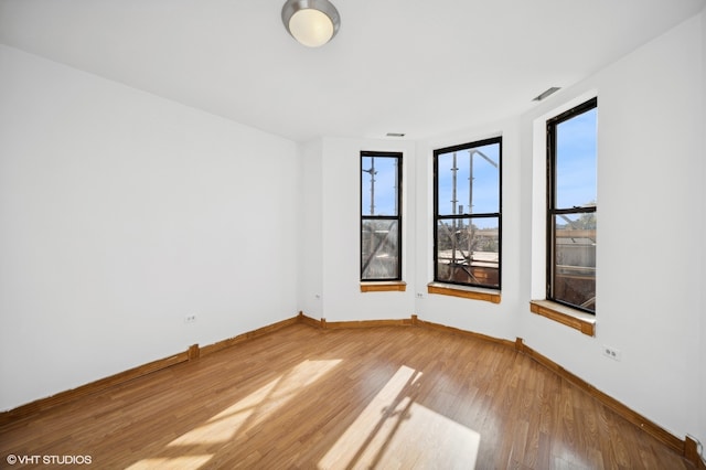 empty room featuring hardwood / wood-style floors