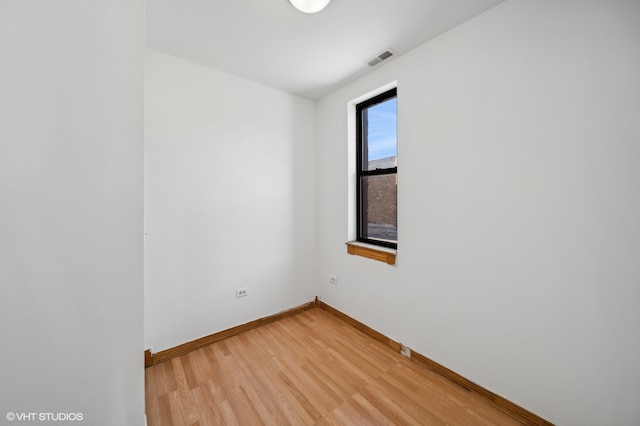 empty room featuring wood-type flooring