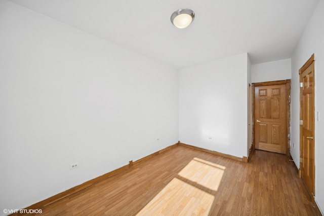 empty room featuring wood-type flooring