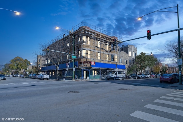 view of outdoor building at dusk