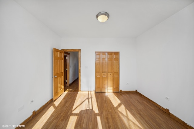 spare room with hardwood / wood-style floors