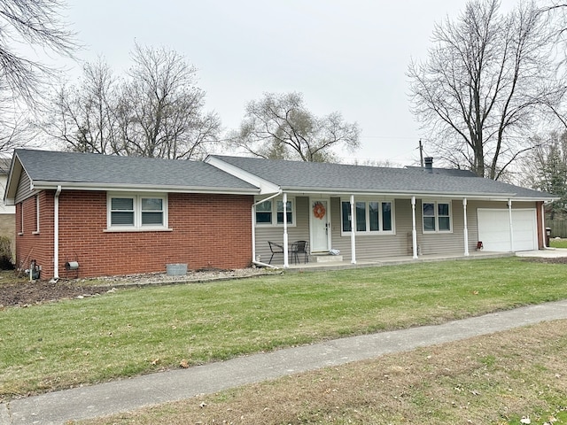 ranch-style home featuring a front yard, a porch, and a garage