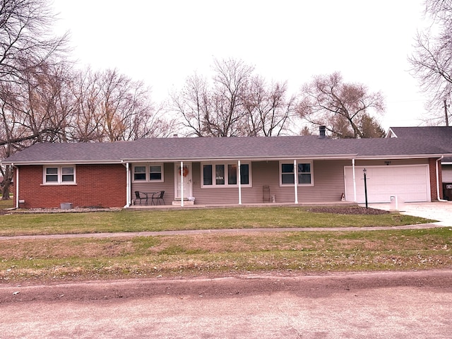 single story home with a garage and a front lawn