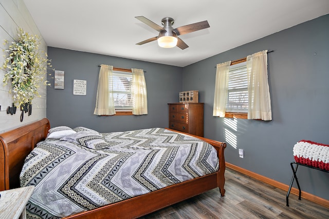 bedroom with ceiling fan and dark wood-type flooring