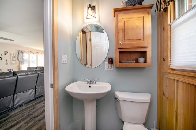 bathroom featuring hardwood / wood-style floors and toilet