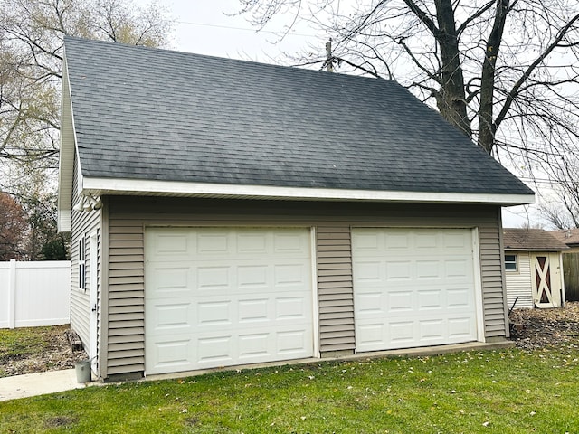 garage with a yard