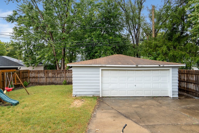 garage featuring a yard