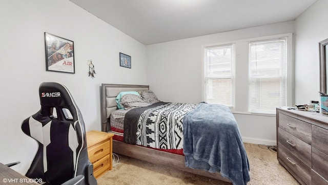 bedroom with light colored carpet