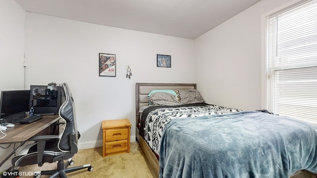 bedroom with light colored carpet