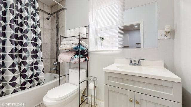 full bathroom featuring vanity, shower / tub combo, and toilet