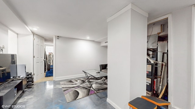 home office featuring concrete flooring