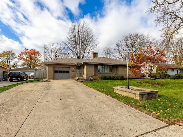 ranch-style home featuring a garage and a front lawn