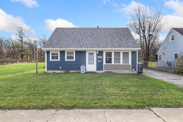 bungalow-style home featuring a front lawn