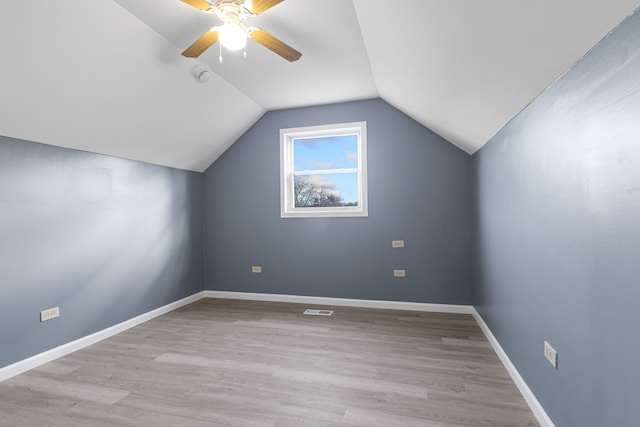 bonus room featuring vaulted ceiling, light hardwood / wood-style flooring, and ceiling fan