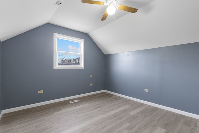 bonus room with light hardwood / wood-style flooring, ceiling fan, and lofted ceiling