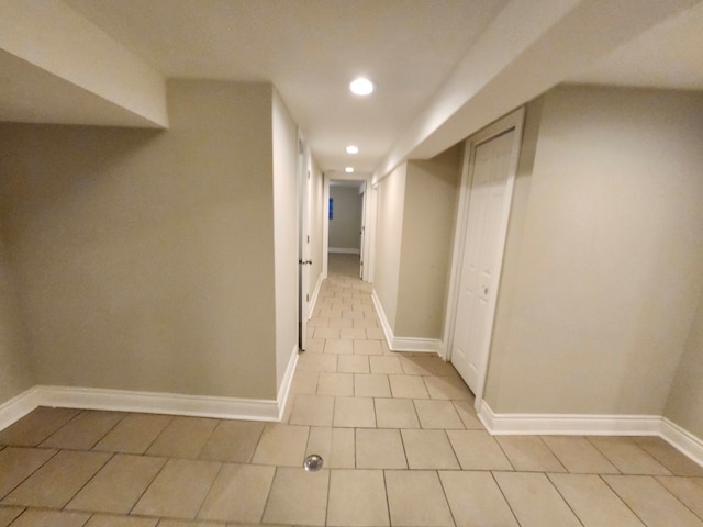 corridor with light tile patterned floors