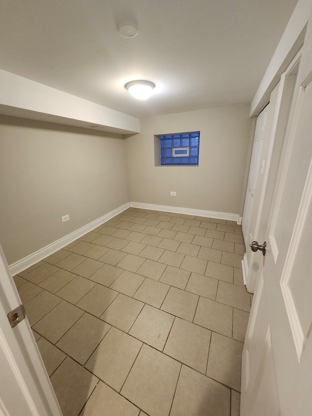 basement with light tile patterned flooring