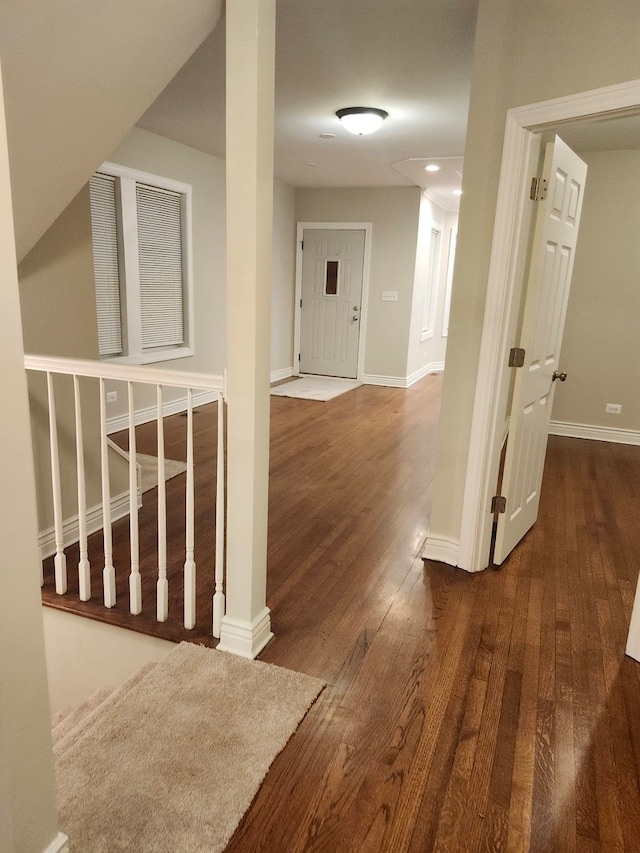 corridor featuring dark hardwood / wood-style flooring