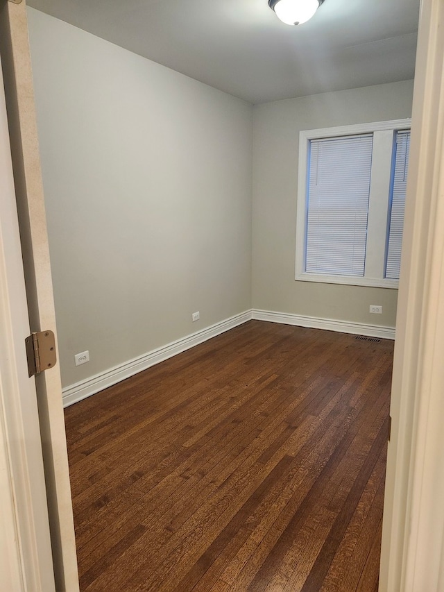 empty room featuring dark hardwood / wood-style floors